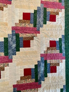 lot 25 image: Handmade Quilt with Floral Backing