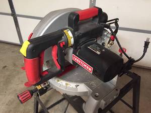 lot 272 image: Craftsman 10 Inch Lasertrac 3 HP Compound Miter Saw on rolling table