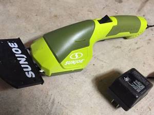 lot 275 image: Sunjoe Leaf Blower and Weed Trimmer