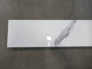 lot 42 image: Calacatta Nowy Single Bevelled 6 in. x 73 in. Polished Engineered Marble (6.08 lin. ft.)