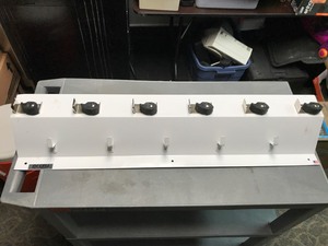 lot 32 image: Ex-Cell Clincher MopBroom Holder (Wall Mounted)