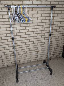 lot 25 image: Rolling Clothing Rack w Hangers