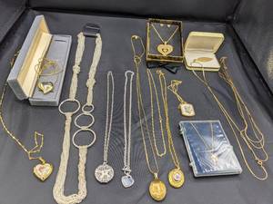 lot 78 image: Lundstroms Black Hills Gold Pendant & Assorted Chains, Lockets, etc.