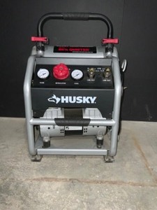 HUSKY 4.5 GAL. PORTABLE ELECTRIC-POWERED SILENT AIR COMPRESSOR. SEE PICTURE