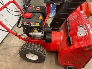 Troy-Bilt 2-Stage Electric Start Snow Blower with Airless Tires  24 in., 243cc Engine, see descriptions in working conditions