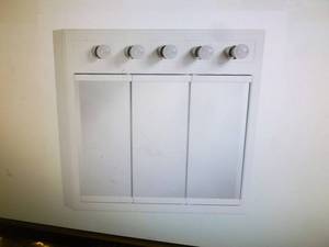 Design house lighted medicine cabinet. 36 wide. Appears new in box. As shown.