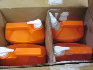 lot 56 image: 4 gojo 1 gallon jugs 2 are opened a...