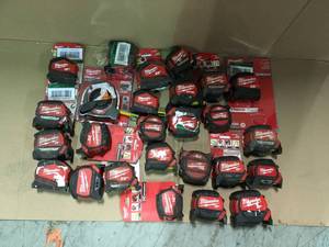 Lot of assorted milwaukee tape measures various sizes and conditions