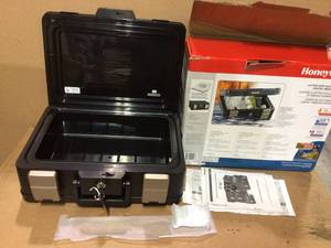 0.24 cu. ft. Molded Fire Resistant and Waterproof Portable Chest with Carry Handle, Key and Double Latch Lock by Honeywell&nbsp&nbspCustomer Returns Open Box See Pictures