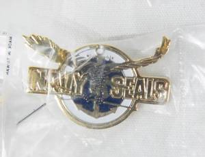 lot 74 image: New Vintage 1991 Navy Seals The Movie Pinback and Promotional Screening VHS Tape Set