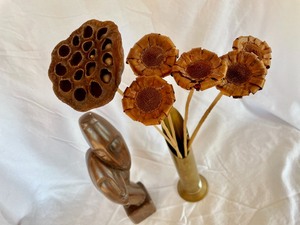 Figural Statue and a Brass Vase with Dried Flowers