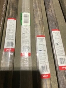 WOOD VINYL MULTI-PURPOSE REDUCER MOLDING. (QUANTITY 31) SEE PICTURES