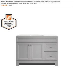HOME DECORATORS SEDGEWOOD BATH VANITY IN DOVE GRAY WITH SOLID SURFACE TECHNOLOGY VANITY TOP IN ARCTIC WHITE SINK.