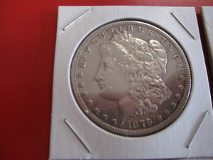 1879-S (San Francisco Mint) Morgan Silver Dollar and 1922-D (Denver Mint) Peace Silver Dollar.