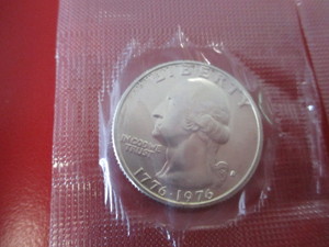 1776-1976 Silver Kennedy Half Dollar and Washington Quarter still in original mint cello packaging.