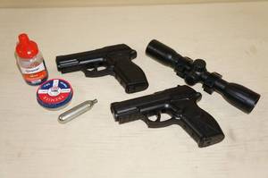 lot 12 image: 2 Air Pellet Pistols and a Scope