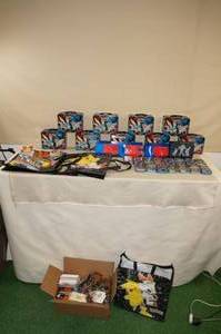lot 100 image: Pokemon Tins, Boxes, and Novelties - Digital Code Cards