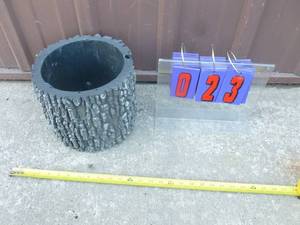 Surreal brand plastic planter. 10 x 8. As shown.