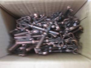 lot of key bottle openers and stapl...