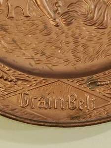 lot 27 image: Metal Grain Belt Mancave Wall Decor