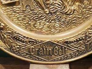 lot 56 image: Round Metal Grain Belt Mancave Wall Decor