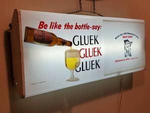 lot 60 image: Very Awesome Original Vintage Metal Gluek Beer Hanging Mancave Sign, item is 5 W x 38 L.x 13 H