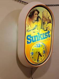 lot 49 image: Rotating Light Sunkist Orange Soda Mancave Wall Clock