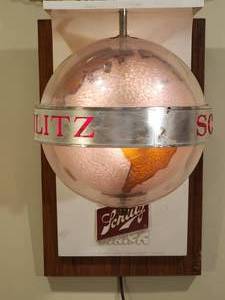 lot 42 image: Awesome Lighted Schlitz Rotating World Mancave Wall Decor