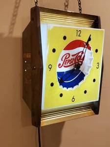 lot 44 image: Lighted Pepsi Mancave Wall Clock