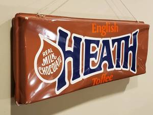 lot 232 image: Double Sided Plastic  Heath Mancave Candy Bar Wall Decor