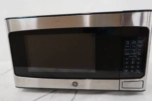 lot 205 image: GE 1.1 cu. Ft. Countertop Microwave in Stainless Steel