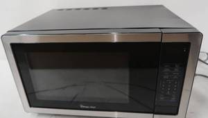 lot 208 image: Magic Chef 1.1 cu. ft. Countertop Microwave in Stainless Steel with Gray Cavity