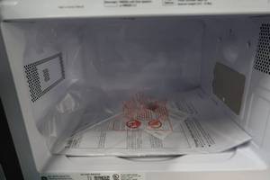 lot 210 image: GE - 0.7 Cu. Ft. Compact Microwave - Stainless steel