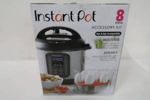 lot 266 image: Instant Pot Official 8-piece CookBake Set 2 Pans, 2 Wire Racks, 2 Red Silicone Lids, 1 Removable Divider, and Removable Base