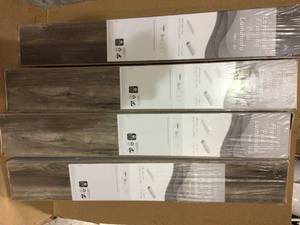 Lakeshore Pecan Bronze 7 mm Thick x 7-23 in. Wide x 50-58 in. Length Laminate Flooring (24.17 sq. ft.  case) Customer Returns See Pictures