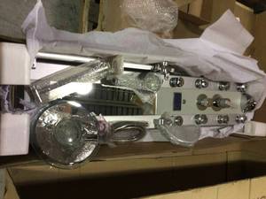 lot 18 image: 51 in. 8-Jet Aluminum Shower Panel System with LED Rainfall Shower Head, LED Shower Wand, Display, Tub Spout and Mirror Customer Returns See Pictures