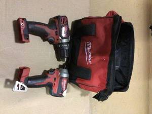 lot 23 image: M18 18-Volt Lithium-Ion Brushless Cordless Compact DrillImpact Combo Kit (2-Tool) Bag by Milwaukee Customer Returns See Pictures