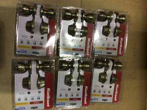 lot 25 image: Tylo Antique Brass Exterior Entry Door Knob and Double Cylinder Deadbolt Combo Pack by Kwikset Customer Returns See Pictures