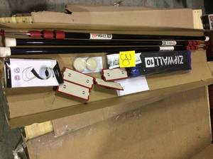 lot 30 image: ZipWall ZP4 Contains 4 10 ft. Steel Spring Loaded Poles 4-Heads, 4-Plates, 4-Tethers, 4-Grip Disks, 2-Zippers and 1-Carry Bag Customer Returns See Pictures