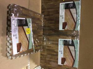 lot 31 image: Set of 3- BrownTravertine 24 in. x 24 in. x 0.47 in. Wood All Purpose Flooring Packs not used Customer Returns See Pictures