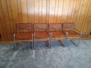 Four Modern Tubular Chrome Plated Steel and Leather Chairs
