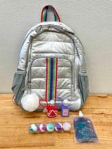 lot 14 image: Full Sized Silver School Backpack, Hand Sanitizer, Bath Bombs Lot