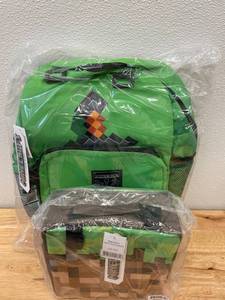 lot 64 image: Minecraft GAMER LOT Sword Backpack, Dirt Block Lunchbox AND Zombie Pigman Plush Toy
