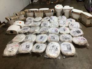 Pallet with New Toilet Seats and assorted Toilet Parts see pictures