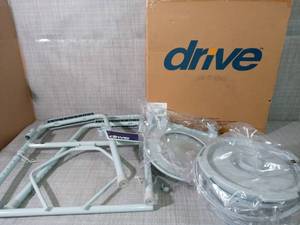 lot 7 image: Folding Steel Bedside Commode by Drive Medical- not used -SEE PICTURES