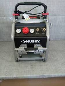 lot 49 image: 4.5 Gal. Portable Electric-Powered Silent Air Compressor by Husky- open box not used -SEE PICTURES