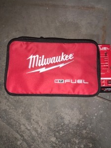 MILWAUKEE M12 FUEL 12-VOLT LITHIUM-ION BRUSHLESS CORDLESS STUBBY 12 IN IMPACT WRENCH KIT WITH ONE 4AH AND ONE 2AH BATTERIES. SEE PICTURES