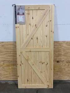 lot 75 image: COLONIAL ELEGANCE 37 in. x 84 in. Artisan K Brace Unfinished Knotty Pine Interior Barn Door Slab