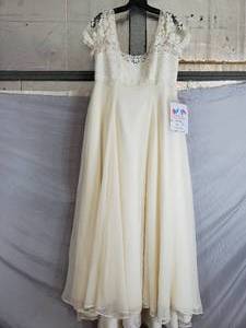 lot 99 image: Designer Bridal Gown $570 Price Tag