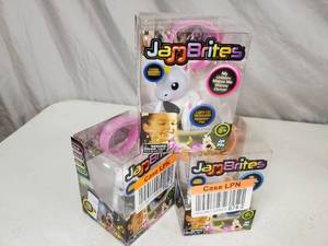lot 118 image: 3 New JamBrites Light Up Bluetooth Speaker Pets with Bracelets